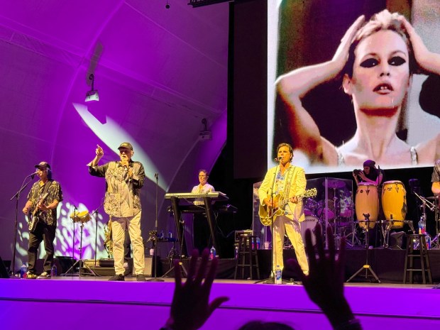 Mike Love, second from right, is the sole original member of the Beach Boys who is still on board with the pioneering band. His son, guitarist-singer Christian Love, is at left. Actor/musician John Stamos, at right, also contributes vocals and guitar parts to the group, as well as drumming. on some songs (Scott Chatfield)