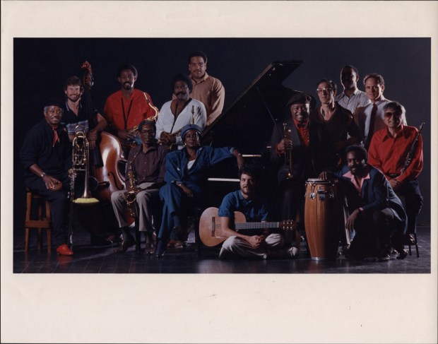In this 1987 photo of leading San Diego jazz musicians, Jimmy Cheatham is shown at the far left and Jeannie Cheatham is seated at the piano. (Union-Tribune file photo)