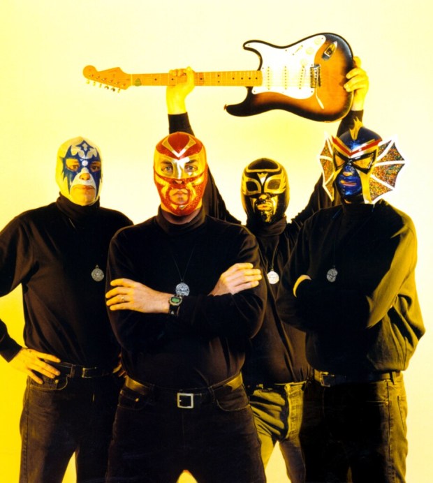 Veteran surf-rock favorites Los Straitjackets are one of the many bands that has performed at Tiki Oasis over the years. (File photo)