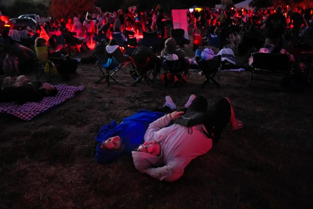 During the Dark Sky Festival, Alex Baldwin and Vanessa Varela of Spring Valley lay on their blanket as they watched the stars and the meteor shower. The festival was held just outside the Menghini Winery in Julian on Saturday, Aug. 16, 2025. (Nelvin C. Cepeda / The San Diego Union-Tribune)