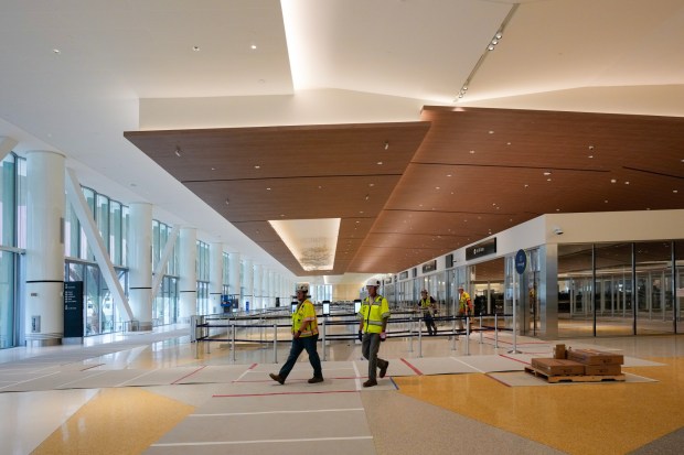The entry point for passengers to enter the airline gates after clearing the TSA checkpoint.Construction is ongoing at the new Terminal 1 of San Diego International Airport on Tuesday, Aug. 26, 2025, in San Diego, California.  (Nelvin C. Cepeda / The San Diego Union-Tribune)