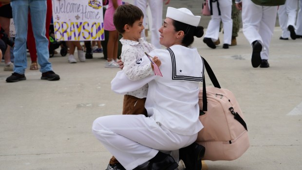 Brianna Sterling hugs her son, Khalil Fahmy, 4, whom she hasn't seen for the last 9 months. Sailors on board the USS Carl Vinson returned from deployment to their homeport at Naval Air Station North Island on Thursday, Aug. 14, 2025, in Coronado, CA. (Nelvin C. Cepeda / The San Diego Union-Tribune)