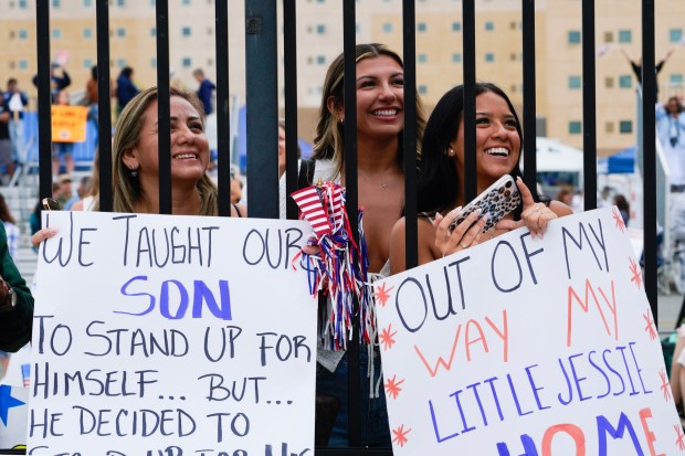 After waiting hours to see her son, Jessie Ramirez, Brenda Ramirez (l) lit with excitement once she saw the Carl Vinson pull into San Diego Bay. Brenda was pierside with her son's girlfriend, Jasmine Delrio (m), and her daughter, Nicole Ramirez (r). Jessie Ramirez is assigned to the Carl Vinson and is among the sailors on board the USS Carl Vinson who are returning from deployment to their homeport at Naval Air Station North Island on Thursday, Aug. 14, 2025, in Coronado, CA. (Nelvin C. Cepeda / The San Diego Union-Tribune)