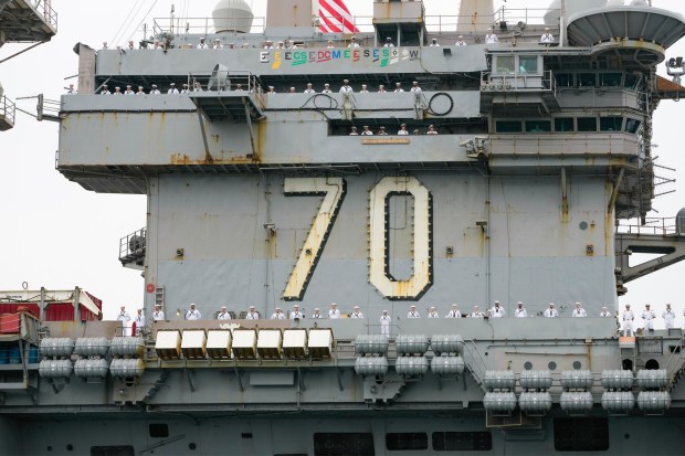 Sailors man the rails as the Carl Vinson pulls into San Diego Bay. Sailors on board the USS Carl Vinson returned from deployment to their homeport at Naval Air Station North Island on Thursday, Aug. 14, 2025, in Coronado, CA. (Nelvin C. Cepeda / The San Diego Union-Tribune)