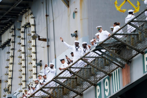 Sailors wave to family and friends as the Carl Vinson pulls into San Diego Bay. Sailors on board the USS Carl Vinson returned from deployment to their homeport at Naval Air Station North Island on Thursday, Aug. 14, 2025, in Coronado, CA. (Nelvin C. Cepeda / The San Diego Union-Tribune)