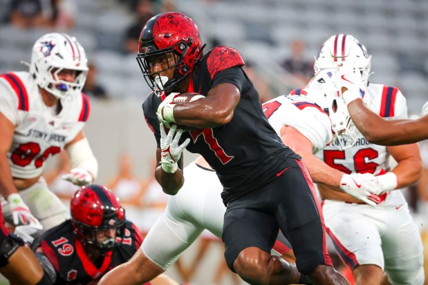 Lucky Sutton #7 of San Diego State runs the ball against Stony Brook during the first half at Snapdragon Stadium on Thursday, Aug. 28, 2025 in San Diego, CA. (Meg McLaughlin / The San Diego Union-Tribune)