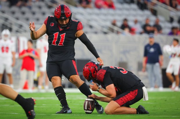 Gabriel Plascencia #11 of the San Diego State Aztecs kicks a field goal against the Stony Brook Seawolves during the first half at Snapdragon Stadium on Thursday, Aug. 28, 2025 in San Diego, CA. (Meg McLaughlin / The San Diego Union-Tribune)