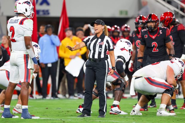 Center judge Krystle Apellaniz talks to players during the first half of San Diego State Aztecs and Stony Brook Seawolves game at Snapdragon Stadium on Thursday, Aug. 28, 2025 in San Diego, CA. (Meg McLaughlin / The San Diego Union-Tribune)