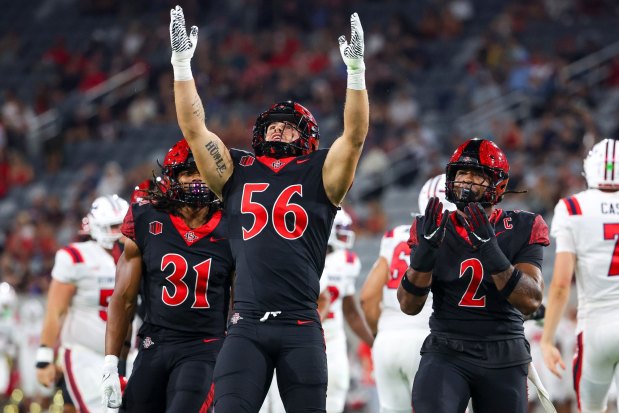Aug. Salvati #56 of the San Diego State Aztecs celebrates after sacking Casey Case #7 of the Stony Brook Seawolves during the first half at Snapdragon Stadium on Thursday, Aug. 28, 2025 in San Diego, CA. (Meg McLaughlin / The San Diego Union-Tribune)