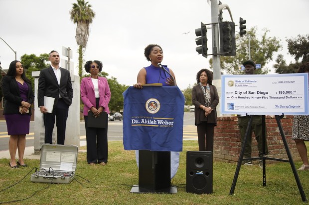 Assemblymember Dr. Akilah Webersecured $195,000 for San Diego to restore and rebuild the historic "Black Family" statue near Mountain View Park. Assemblymember Dr. Akilah Weber speaks to a group of community members in Mountain View on Tuesday, Oct. 10, 2023 in San Diego, California. (Alejandro Tamayo / The San Diego Union-Tribune