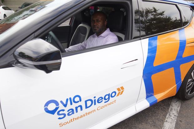 Driver David Norman behind the wheel of a Southeastern Connect shuttle at Market Creek Plaza on Tuesday, Aug. 12, 2025 in San Diego. (Michael Ho / The San Diego Union-Tribune)