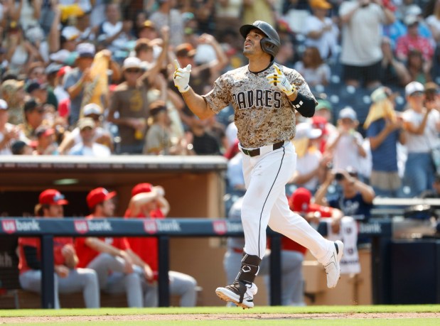 Ramón Laureano #5 of San Diego Padres round the bases after hitting a solo home run in the eighth  inning against the St. Louis Cardinals at Petco Park on Aug. 3, 2025 in San Diego, California. (K.C. Alfred / The San Diego Union-Tribune)