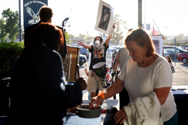 Pro-Palestinian protestors chant outside before Rep. Sara Jacobs' town hall at Madison High School on Wednesday, July 30, 2025 in San Diego, Calif. (Meg McLaughlin / The San Diego Union-Tribune)