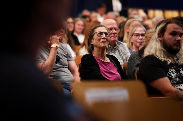 Attendees listen to Rep. Sara Jacobs speak during a town hall at Madison High School on Wednesday, July 30, 2025 in San Diego, CA. (Meg McLaughlin / The San Diego Union-Tribune)