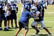 Dallas Cowboys defensive tackle Mazi Smith (58) runs a pass rushing drill during a training...