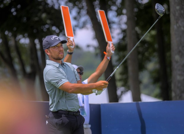 Xander Schauffele tees off at the15th green in which he...