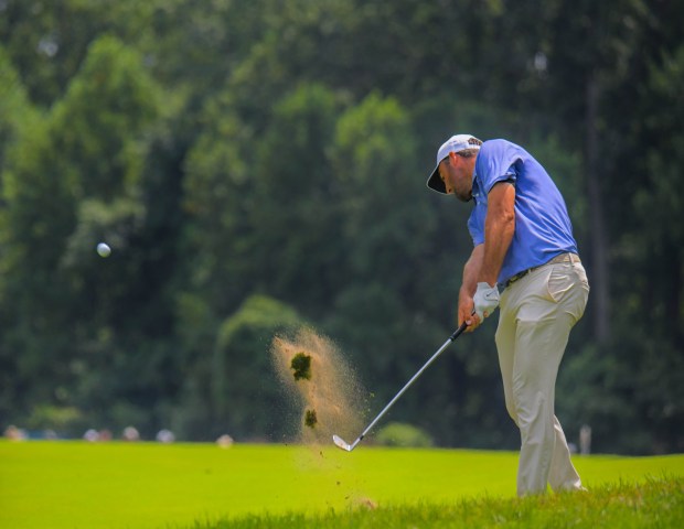 Scottie Scheffler plays to the 8th hole in which he...