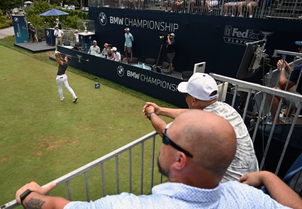 Golf fans watch Viktor Hovland tee off to start the...