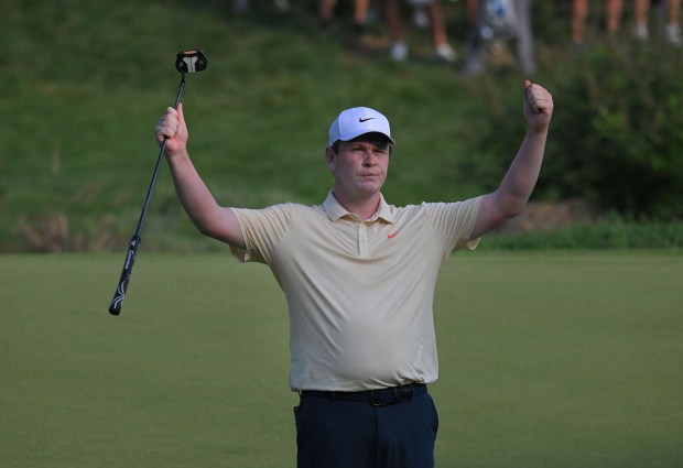 Leader Robert MacIntyre reacts after a 41 foot birdie putt...