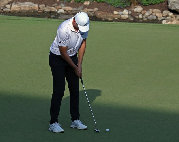 Ludvig Aberg makes a birdie putt on the 18th to...