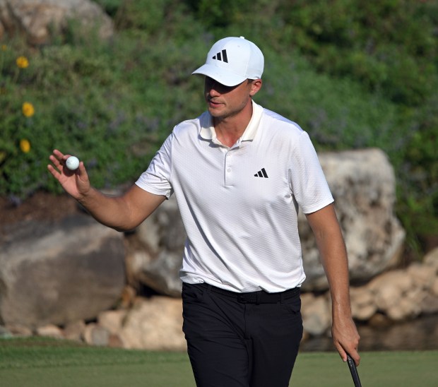 Ludvig Aberg acknowledges the crowd after birdieing the 18th hole...