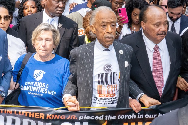 From left, Randi Weingarten, Al Sharpton and Martin Luther King III participate in a "March on Wall Street" to call for economic justice on August 28, 2025, in New York City. (Theodore Parisienne / New York Daily News)