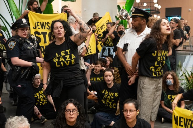NYPD officers arrest people protesting with Jewish Voices for Peace after refusing to leave the lobby to U.S. Senator Chuck Schumer's office in Manhattan Friday, Aug. 1, 2025. (Barry Williams/New York Daily News)