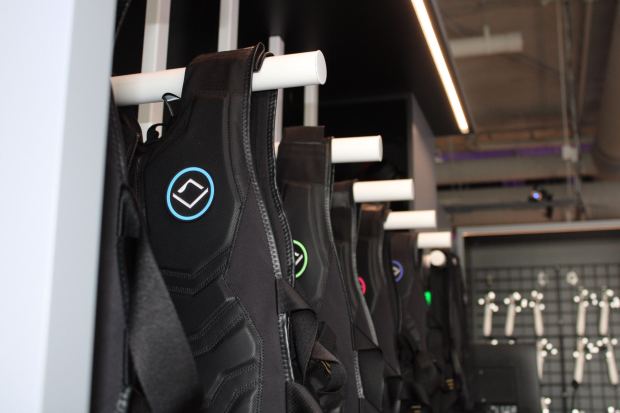 Players wear haptic vests, motion sensors on their wrists and ankles and headsets at Sandbox VR's new Virginia Beach location. (Maddie Mohamadi / The Virginian-Pilot)