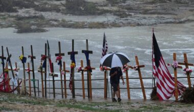 Rain falls over a makeshift memorial for flood victims along the Guadalupe River, Sunday, July 13, 2025, in Kerrville, Texas. (AP Photo/Eric Gay)