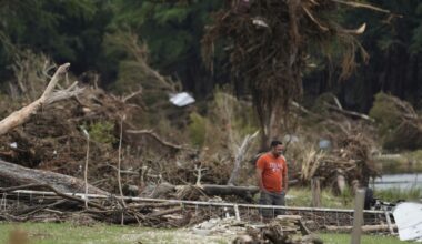 A man surveys debris and flood damage along the Guadalupe River, Sunday, July 13, 2025, in Kerrville, Texas. (AP Photo/Eric Gay)