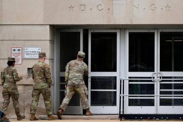 National Guard troops arrive at the District of Columbia National Guard Headquarters, Tuesday, Aug. 12, 2025, in Washington. (AP Photo/Julia Demaree Nikhinson)