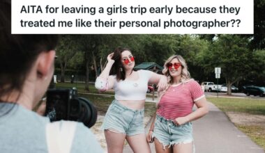 Two fashionable girls posing as another woman takes their photo