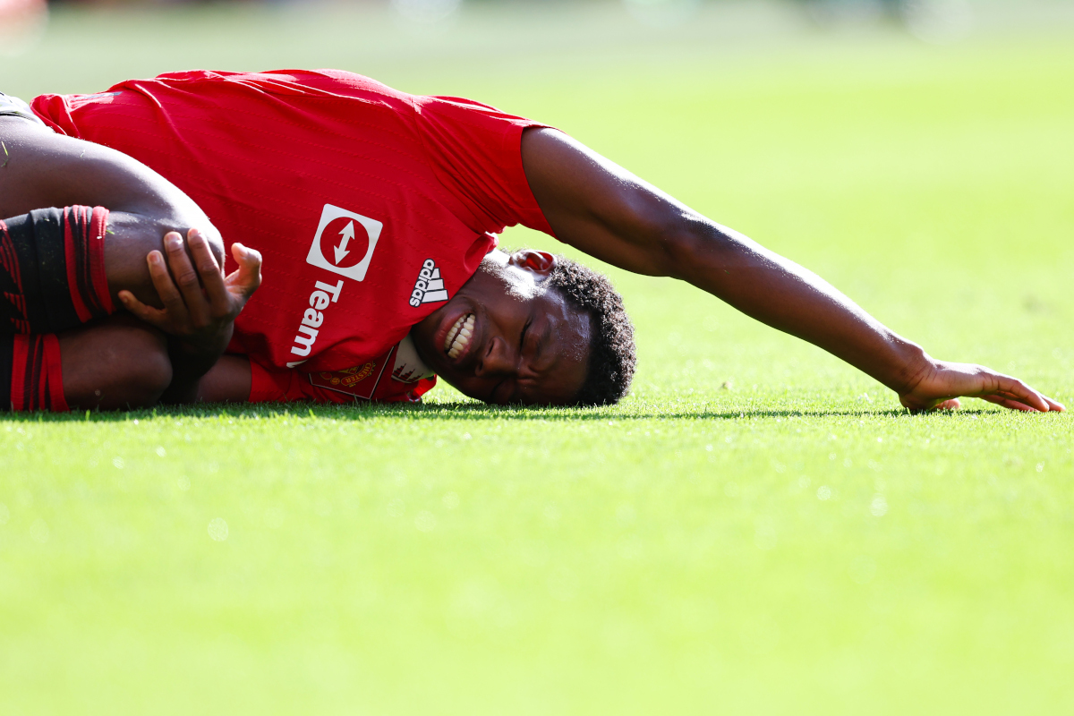MANCHESTER, ENGLAND - MAY 28: Tyrell Malacia of Manchester United lies injured on the pitch during the Premier League match between Manchester United and Fulham FC at Old Trafford on May 28, 2023 in Manchester, England. (Photo by Matt McNulty/Getty Images)