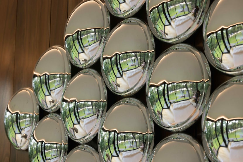 A sculpture of recycled hubcaps at the "Recycled Glass House."