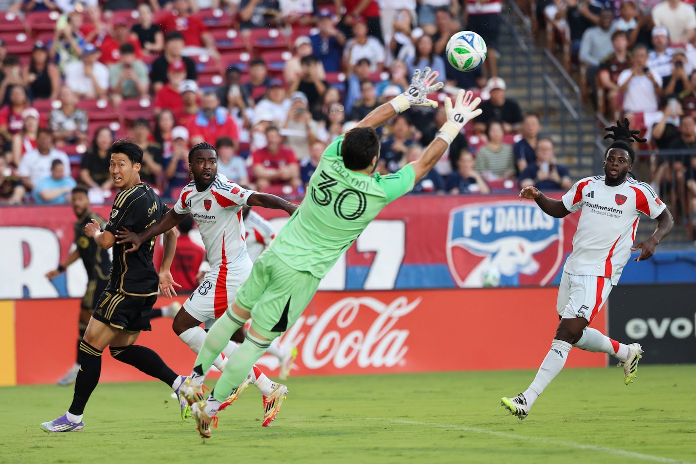 FC Dallas goalkeeper Michael Collodi (30) saves a shot by Los Angeles FC forward Son...