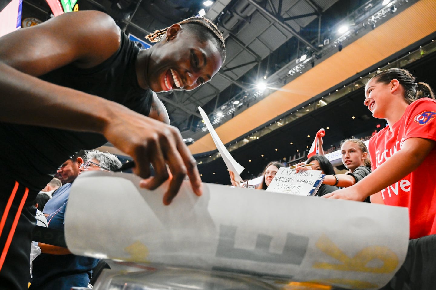 Connecticut Sun guard Saniya Rivers signs autographs before the Sun played the Indiana Fever at TD Garden on July 15.