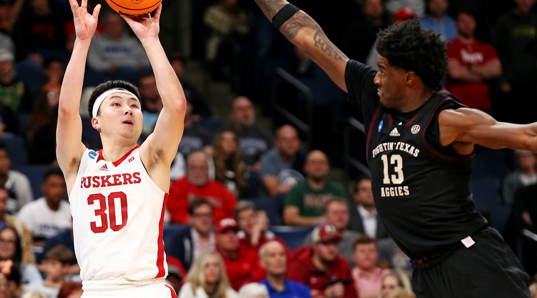 Mar 22, 2024; Memphis, TN, USA; Nebraska Cornhuskers guard Keisei Tominaga (30) shoots the ball against Texas A&M Aggies forward Solomon Washington (13) during the second half in the first round of the 2024 NCAA Tournament at FedExForum. Mandatory Credit: Petre Thomas-USA TODAY Sports