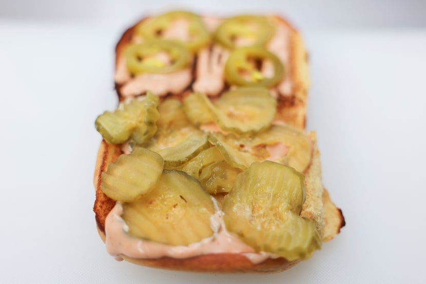 Time to eat your vegetables. NADC's burger has Mount Olive pickles on one side, "tamed"...