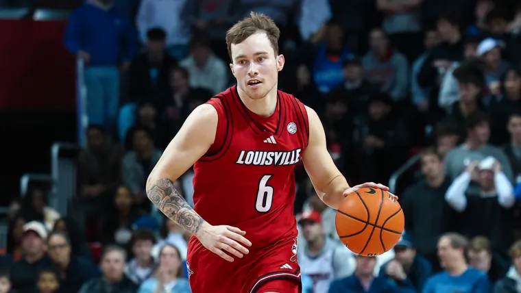 2-time NCAA champion coach says he'd return to Louisville 'in a New York minute' despite scandal image