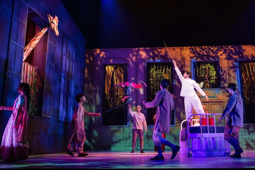 Taha Mandviwala in white as the title character with the cast of the national tour of  Life...