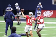 Dallas Cowboys quarterbacks Will Grier (15) and Joe Milton III (10) throw during a drill in...