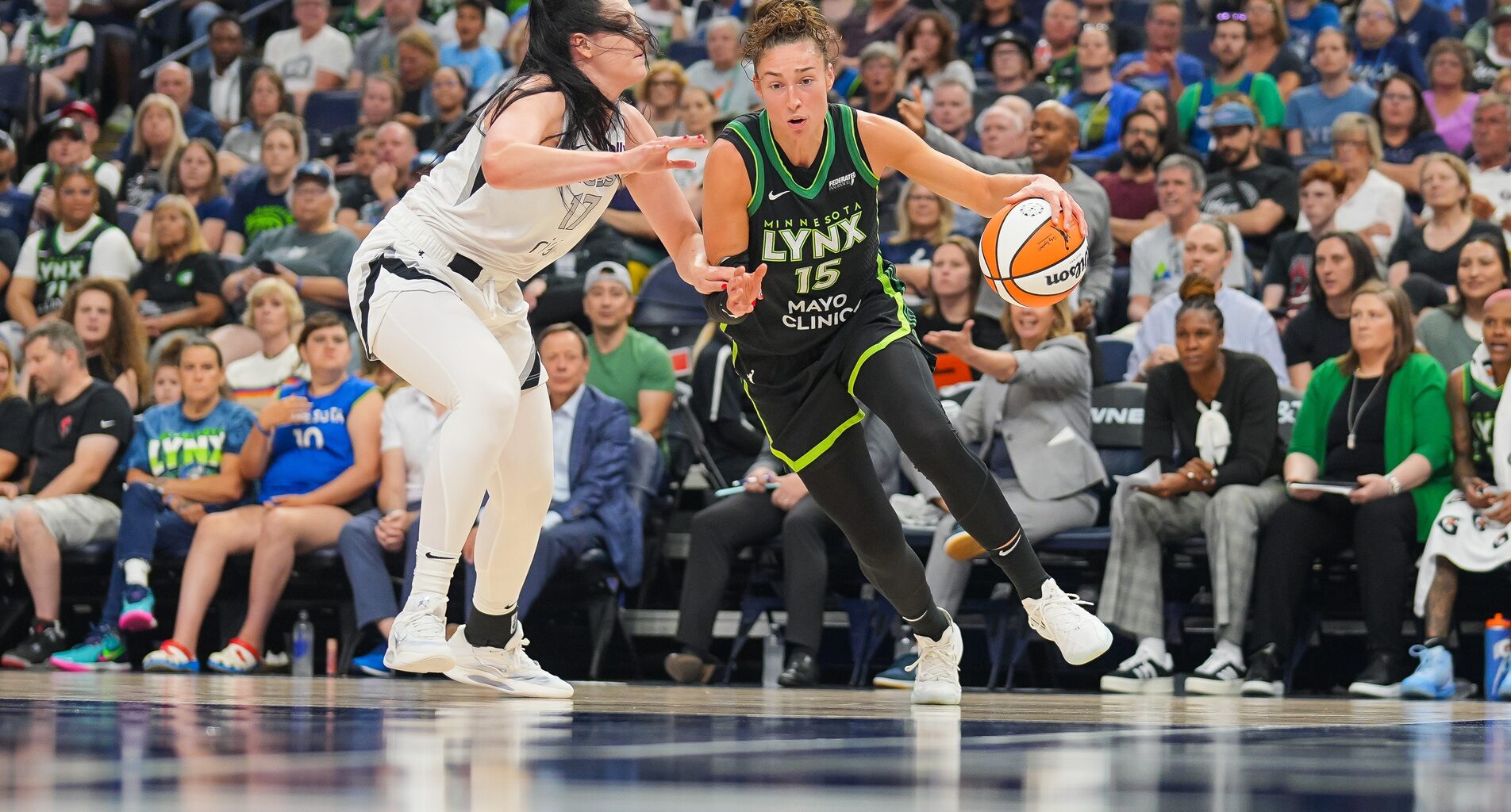 Minnesota Lynx forward Jessica Shepard (15) dribbles against the Las Vegas Aces center Megan Gustafson (17) in the third quarter at Target Center.