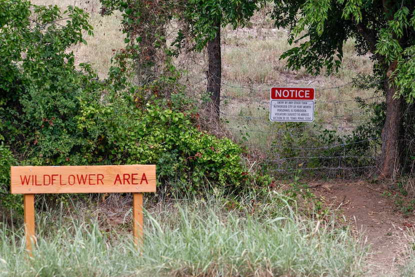 A trail entrance to The Village Creek Drying Beds in Fort Worth is blocked with a barbed...