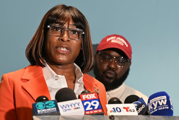 From left, Celena Morrison-McLean and Darius McLean hold a news conference on Thursday, March 7, 2024 in Philadelphia. The Philadelphia city official was arrested over the weekend during a traffic stop and started recording the incident because she feared for her husband's life as a trooper handcuffed him on a rainy elevated highway. (Tom Gralish/The Philadelphia Inquirer via AP)
