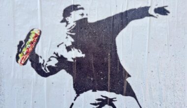 Street art depicts former Justice Department employee Sean Charles Dunn on a wall in the Union Market District neighborhood Aug. 16 in Washington.