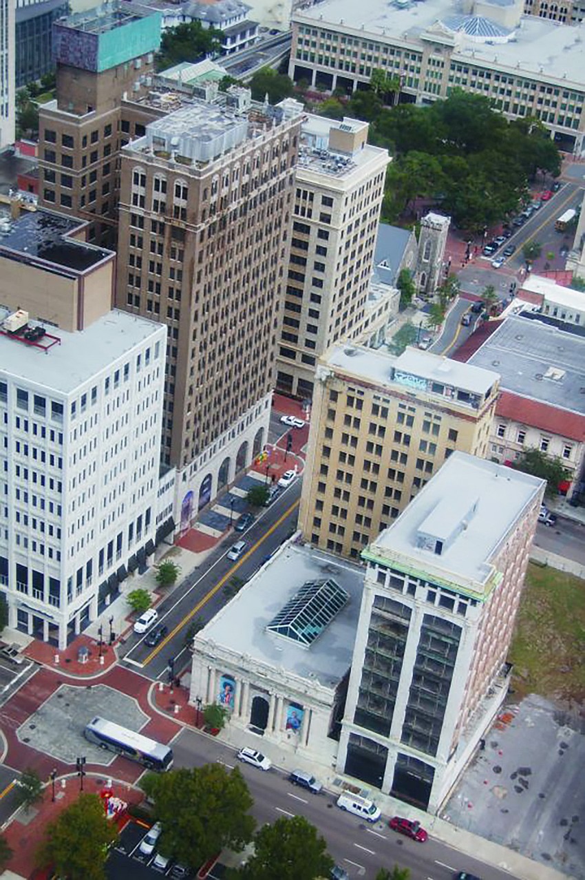 Tallest building at left, The Barnett National Bank Building, now called The Residences at Barnett. Right, the Laura Street Trio. Tallest building at left, The Barnett National Bank Building, now called The Residences at Barnett. Right, the Laura Street Trio.