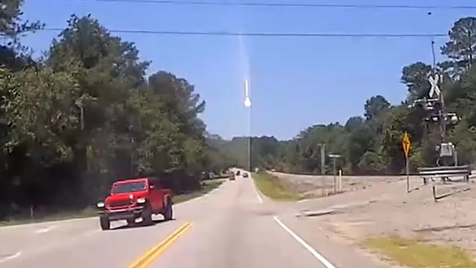 A still from dashcam video shows a big flash of light coming down from the sky in Lexington County, South Carolina, on June 26. - Brenda Eckard