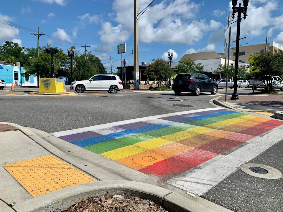 A rainbow-colored design celebrating Pride illustrates a crosswalk at the Five Points Intersection of the Riverside neighborhood in Jacksonville, Fla. on July 11, 2025.