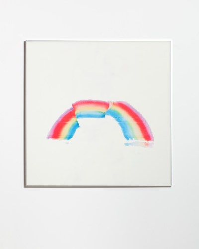A painting of a rainbow cut in three places.