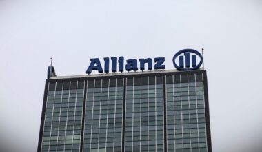 a photo of Allianz's logo at the top of a building.